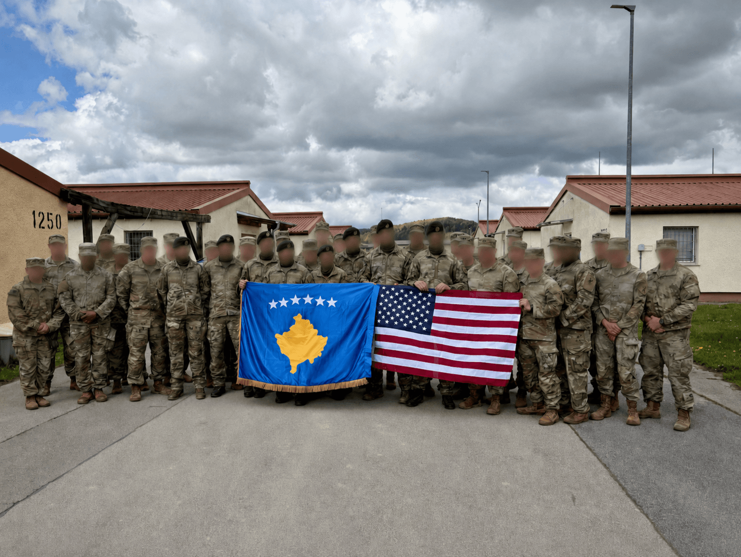 U.S. Army and Kosovo Security Force soldiers holding American and Kosovo flags during Combined Resolve 26-07